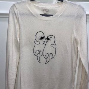 Otter holding hands sweater